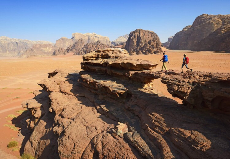 Couple hiking at Rock Arch, Al Borg Alsagheer, Wadi Rum, Jordan, Middle East, Orient
- Model Released -